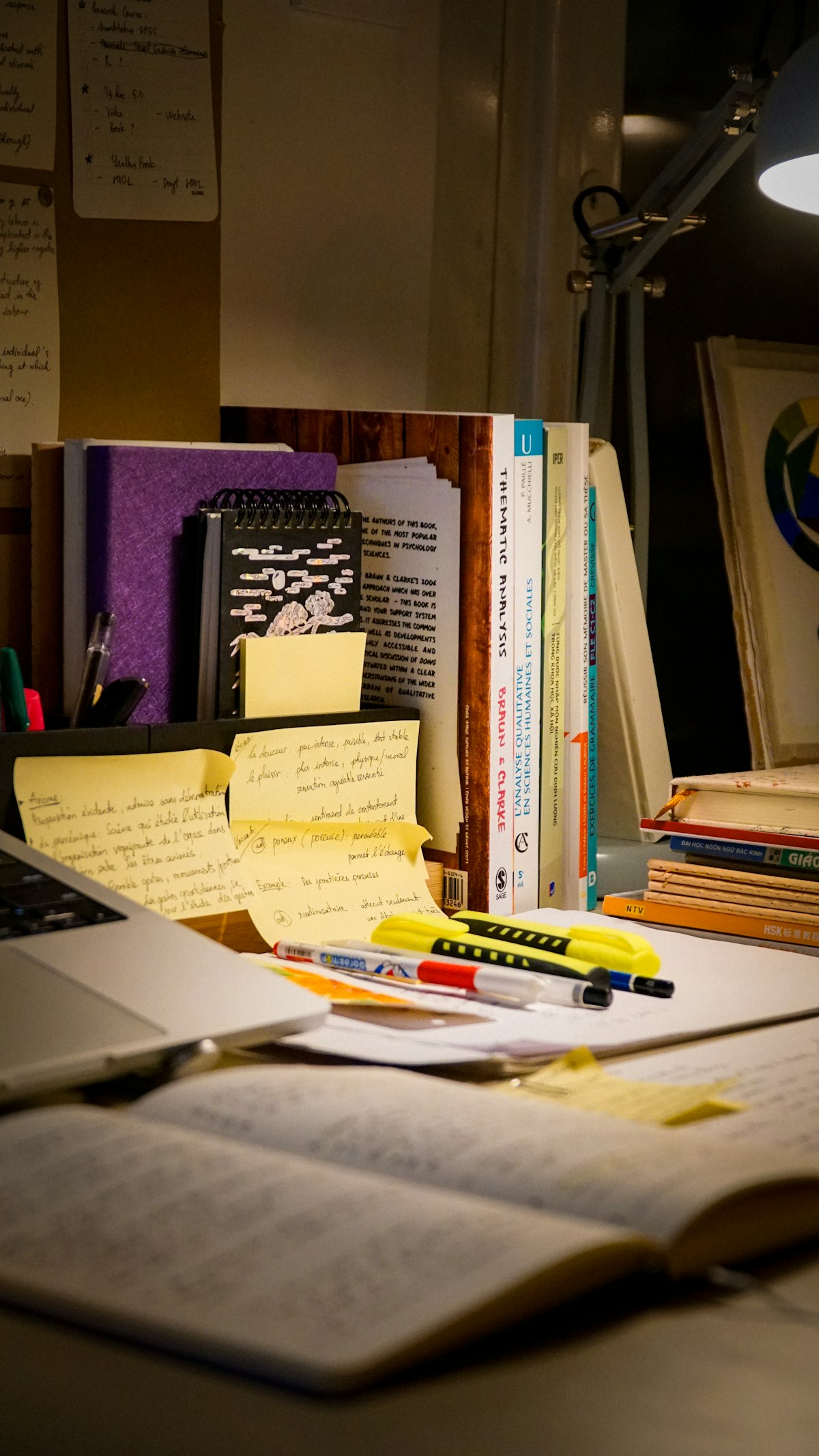 A self-paced study desk with a laptop and course notes